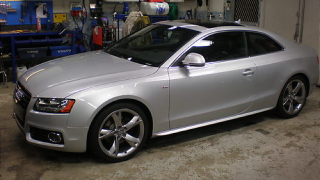 Illustration for article titled Watch an Audi A5 transform into a drag car